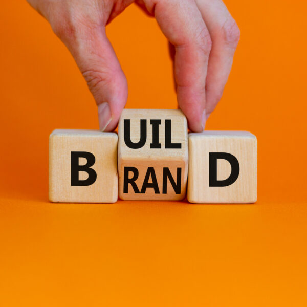 Building blocks that spell “build” and “brand” to illustrate how branding in B2B marketing takes time and effort.